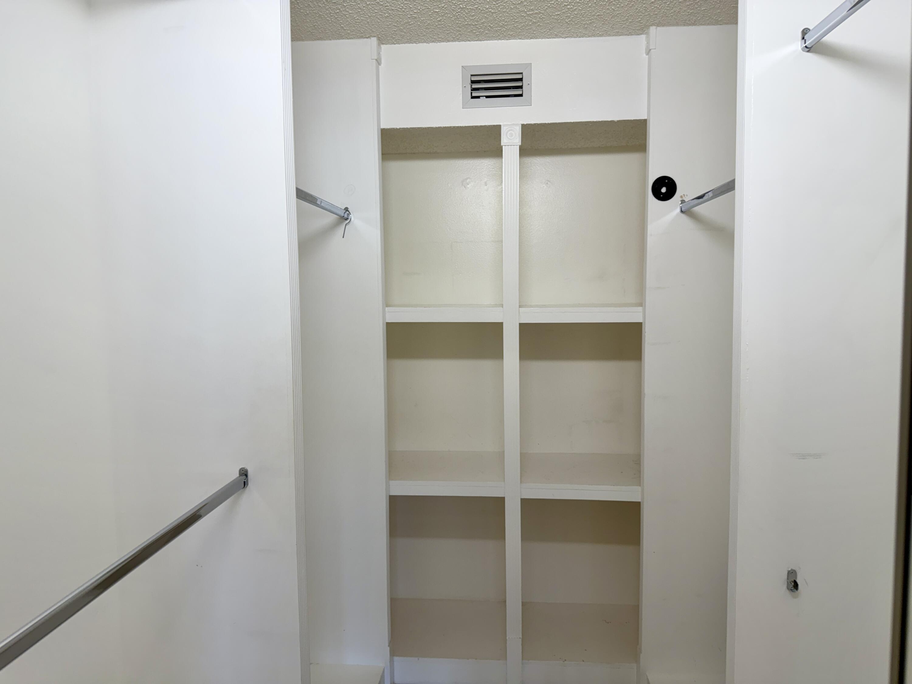 104 Half Moon Circle, Unit B2 Hypoluxo, FL 33462 - Photo 16 of 26 PRIMARY BEDROOM CLOSET