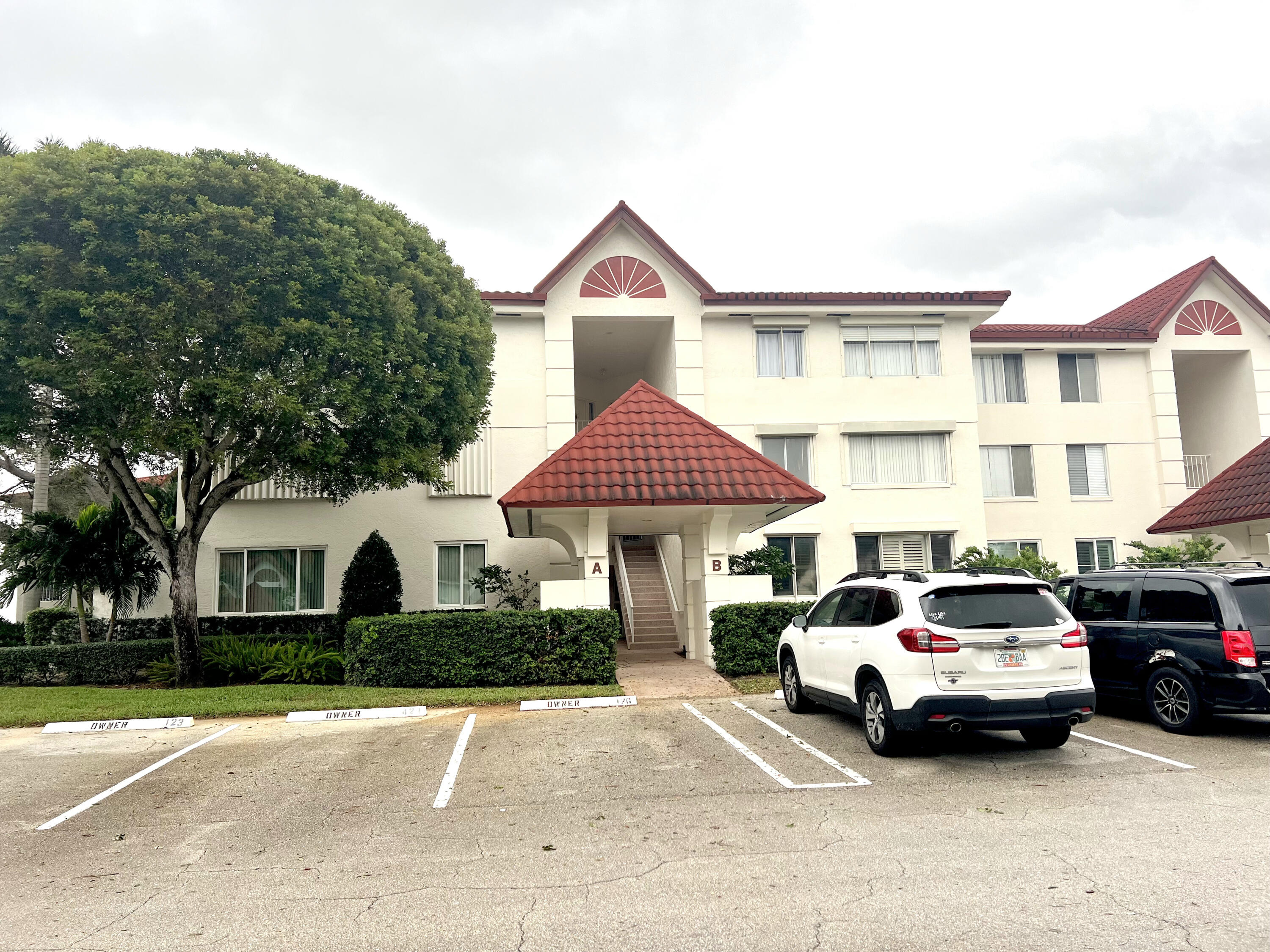 104 Half Moon Circle, Unit B2 Hypoluxo, FL 33462 - Photo 2 of 26 FRONT EXTERIOR