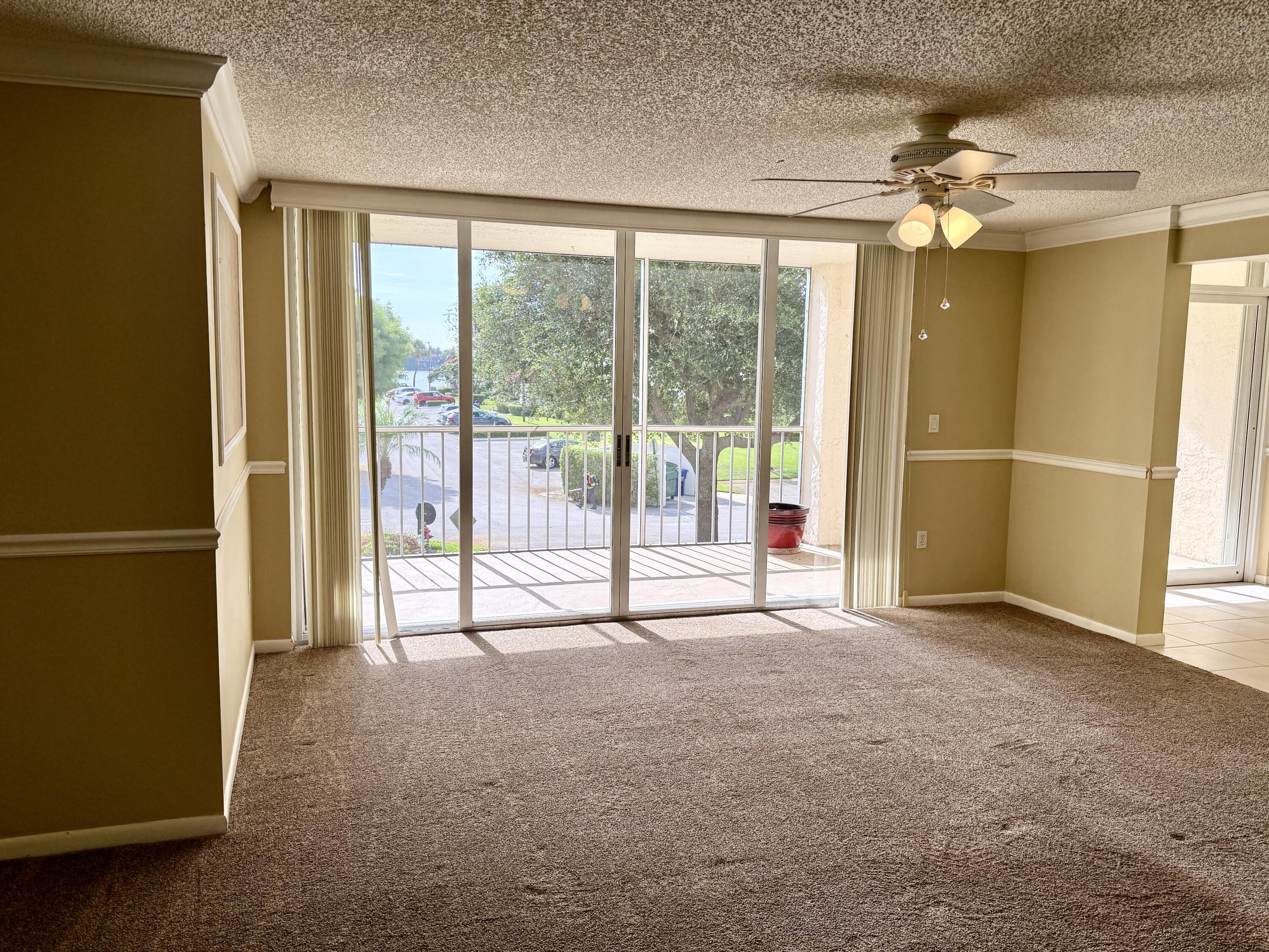 104 Half Moon Circle, Unit B2 Hypoluxo, FL 33462 - Photo 6 of 26 LIVING ROOM