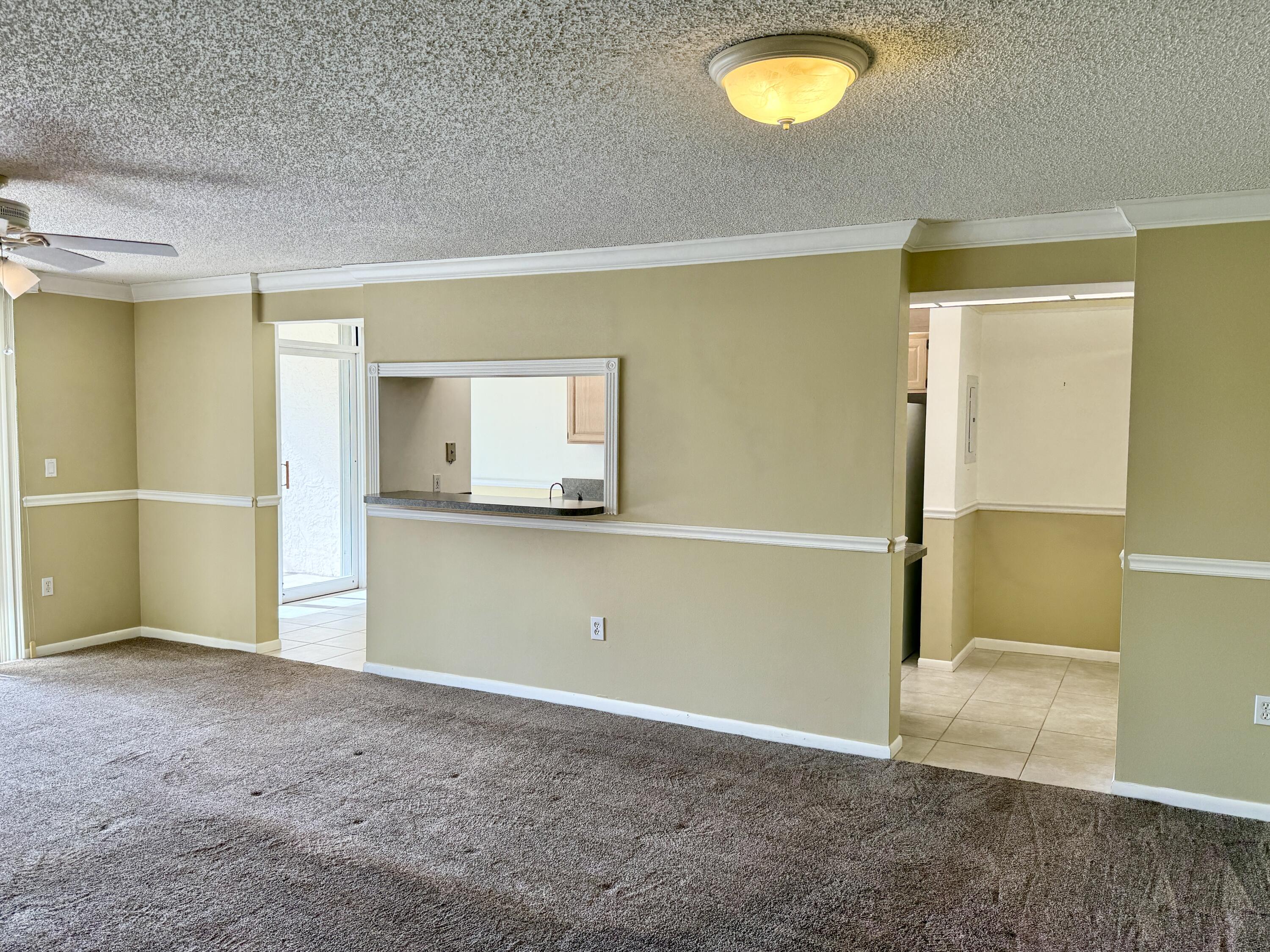 104 Half Moon Circle, Unit B2 Hypoluxo, FL 33462 - Photo 7 of 26 LIVING ROOM