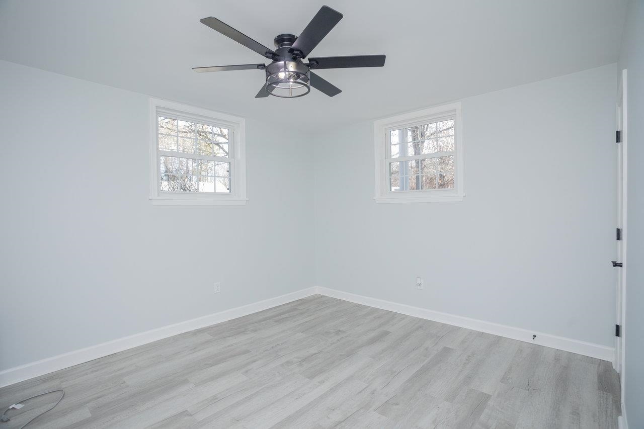 12 Essex Road Grottoes, VA 24441 - Photo 48 of 65 wooden floor in an empty room with a window