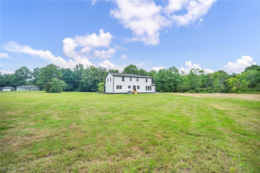 3759 Herr Fieldhouse Road Southington, OH 44470 - Photo 31 of 35 Expansive grounds showcasing a sprawling manicured lawn with mature tree line bordering the property