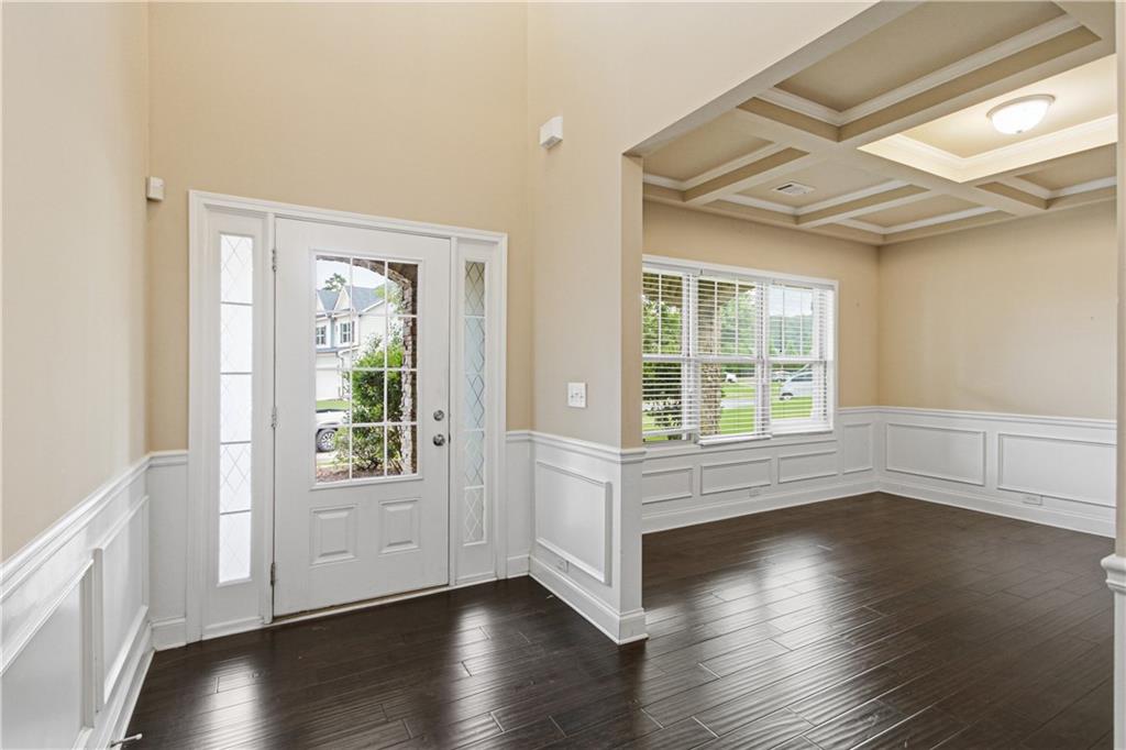 114 Madison Street Canton, GA 30115 - Photo 6 of 39 an empty room with wooden floor and windows