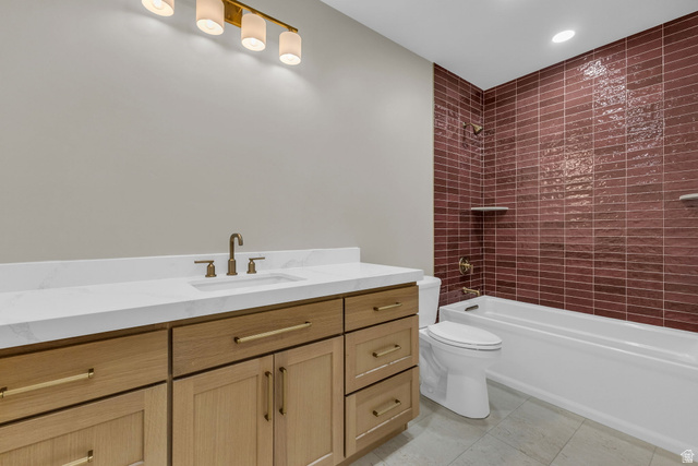 2828 Jojo Road Eagle Mountain, UT 84005 - Photo 48 of 63 Bathroom featuring a light wood-finish vanity with a white countertop and integrated sink