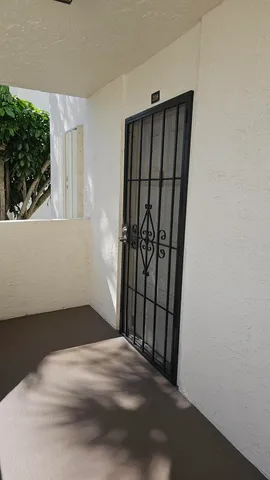 a view of a chairs and table in the balcony