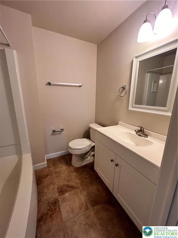 402 Prospect Avenue, Unit E3 Bethlehem, PA 18018 - Photo 13 of 19 a bathroom with a sink a toilet and mirror