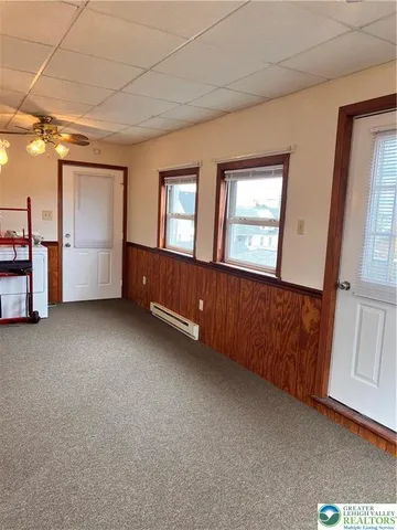 a view of an empty room with a window