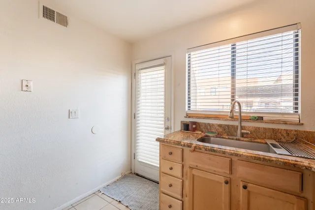 a kitchen with a sink and a window