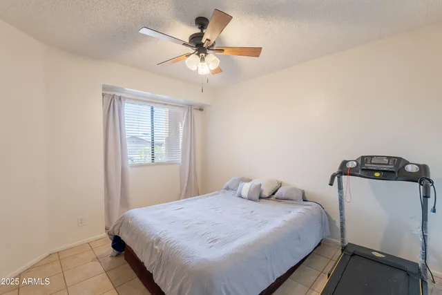 a bathroom with a shower curtain and a toilet