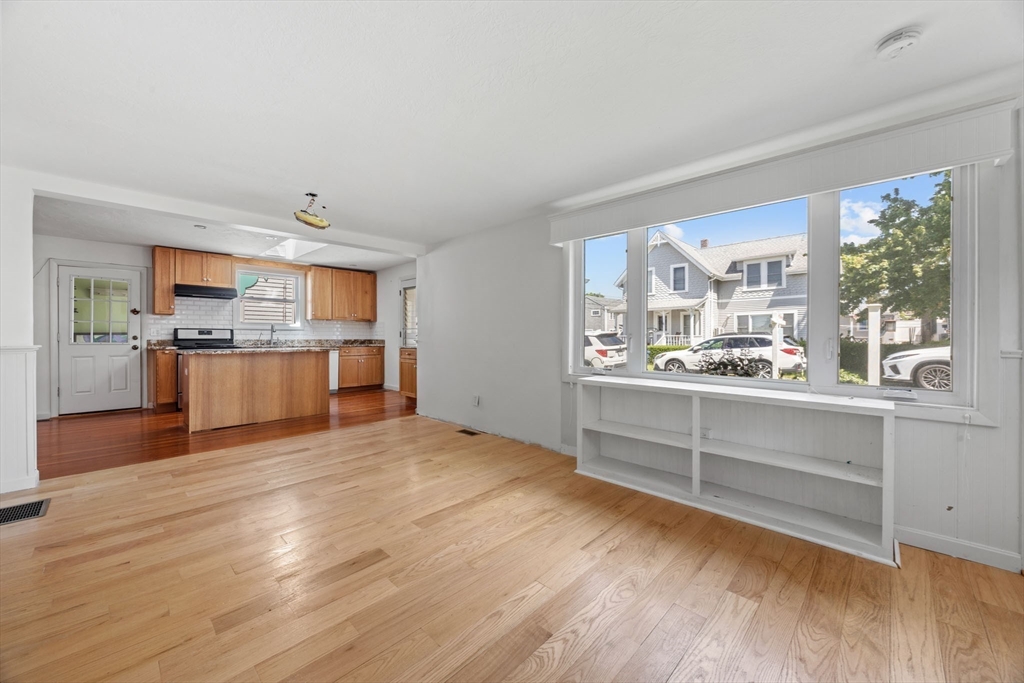 7 Grove Street Wareham, MA 02558 - Photo 11 of 41 a view of a kitchen with wooden floor and electronic appliances