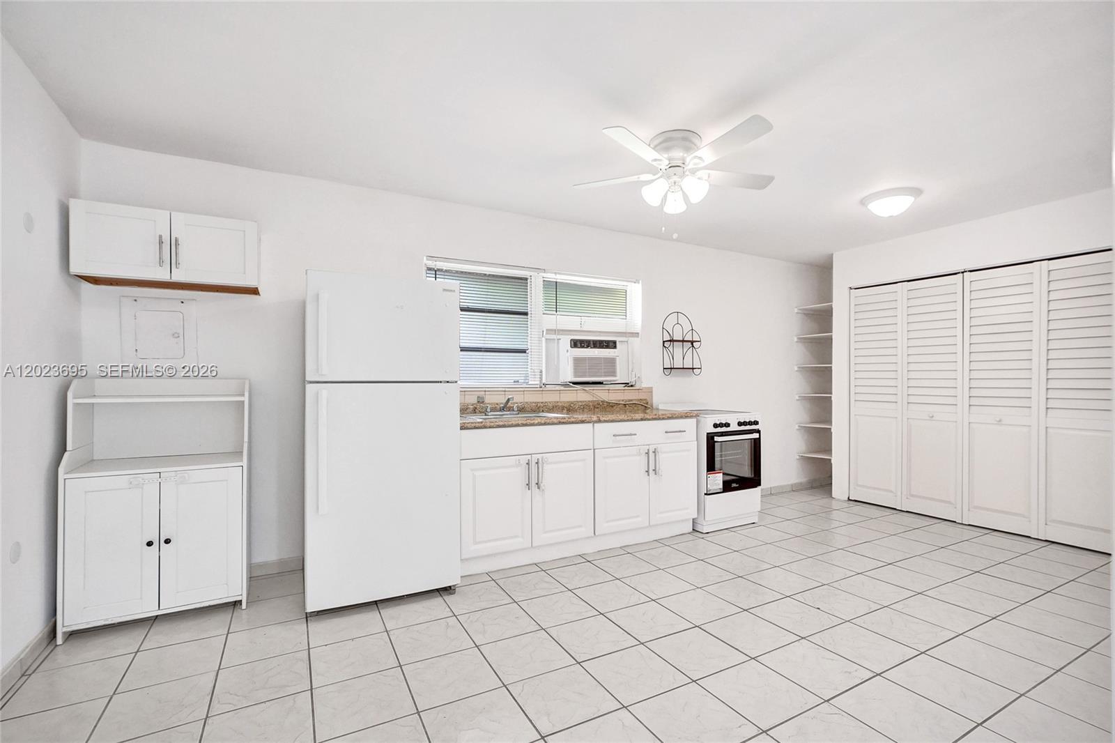 877 West 33rd Street, Unit A Hialeah, FL 33012 - Photo 12 of 36 Kitchen/Family/Dining Area