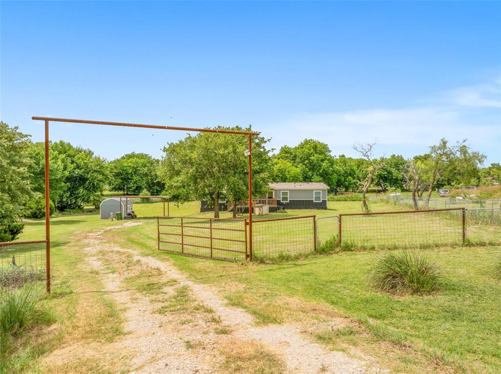 514 Blue Sky Court Springtown, TX 76082 - Photo 1 of 40 Fully fenced lot with gate