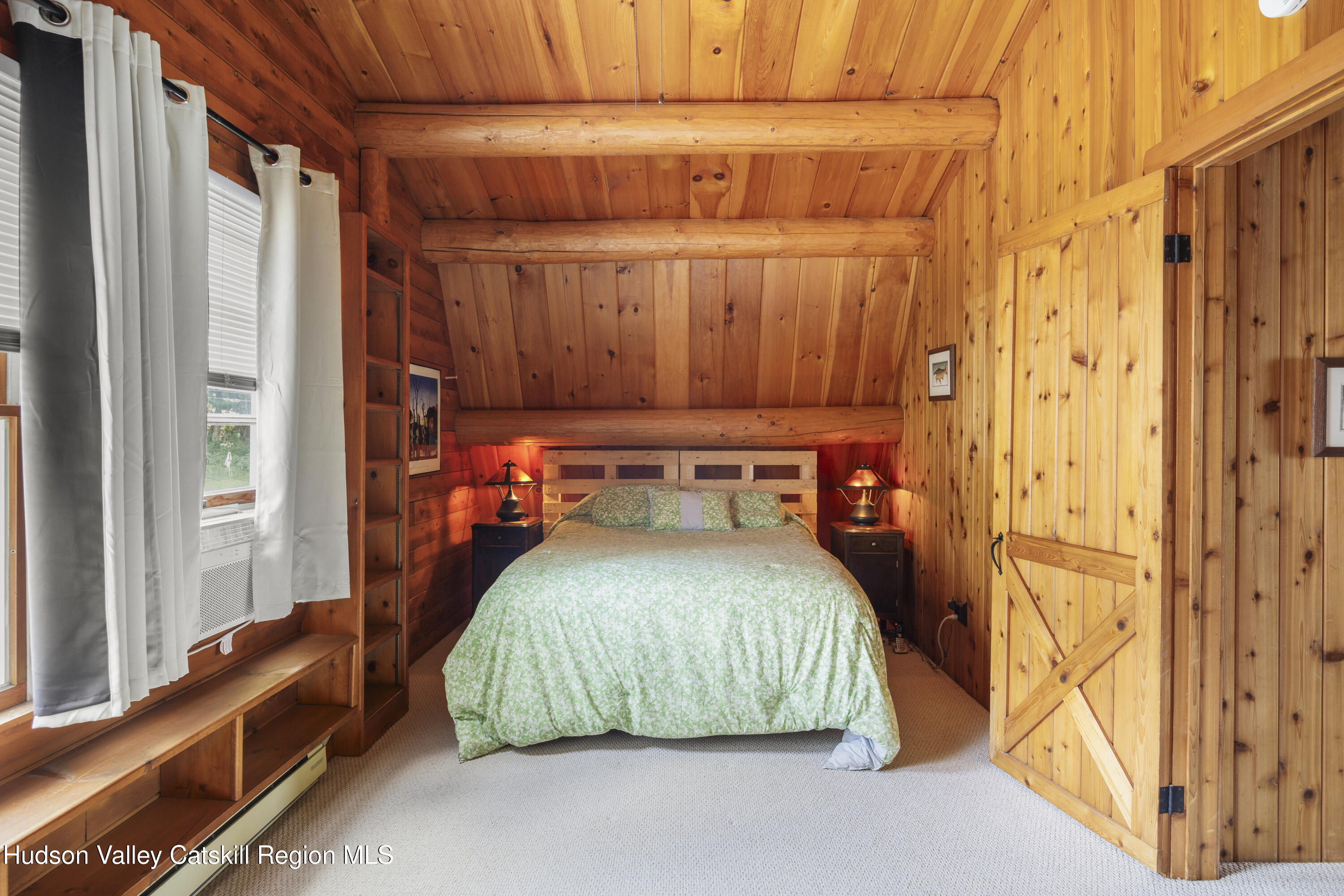 407 Lakeview Road Craryville, NY 12521 - Photo 14 of 24 a bedroom with a bed and a window