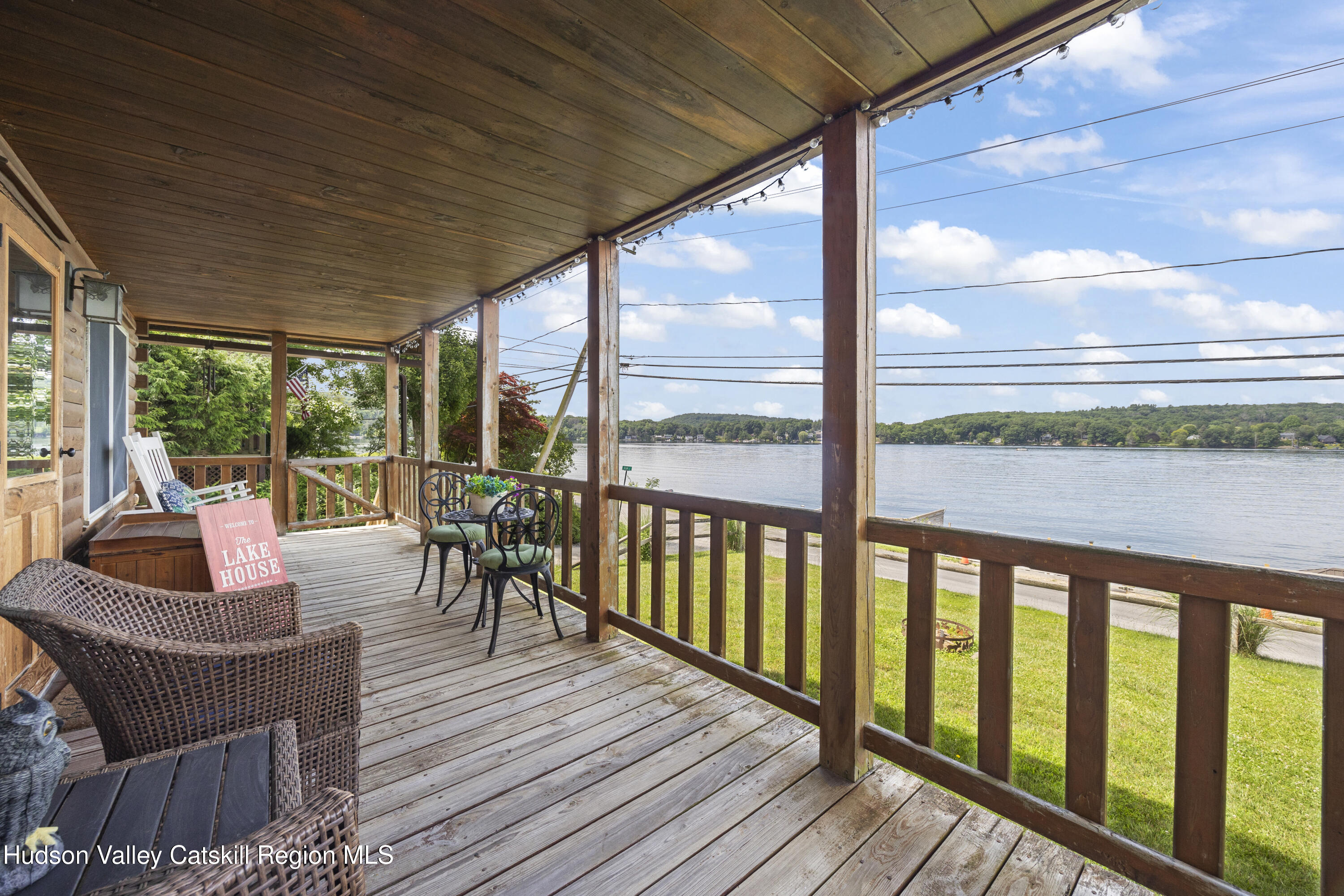407 Lakeview Road Craryville, NY 12521 - Photo 19 of 24 a balcony with furniture and wooden floor
