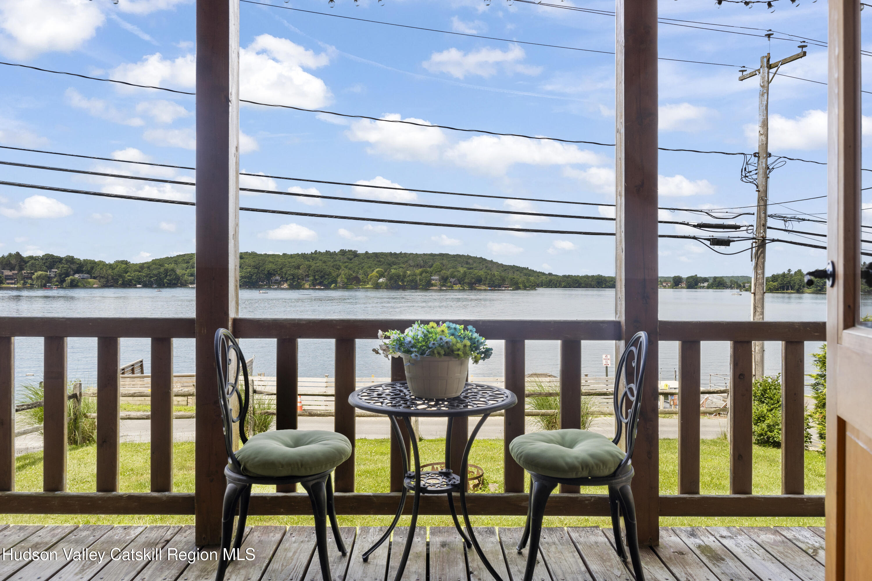 407 Lakeview Road Craryville, NY 12521 - Photo 20 of 24 a view of a chairs and table in the balcony