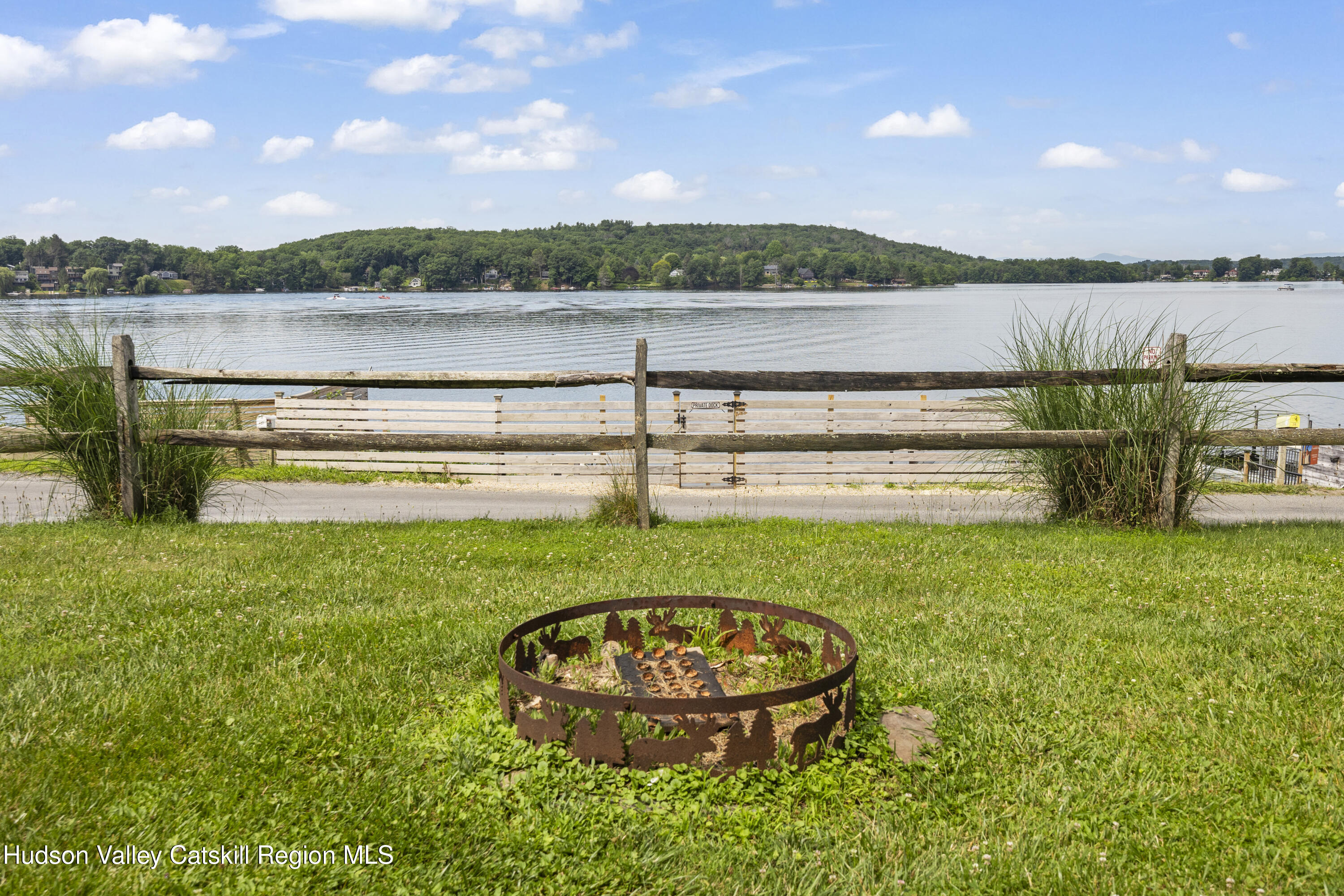 407 Lakeview Road Craryville, NY 12521 - Photo 5 of 24 a view of a lake with a lake in the background