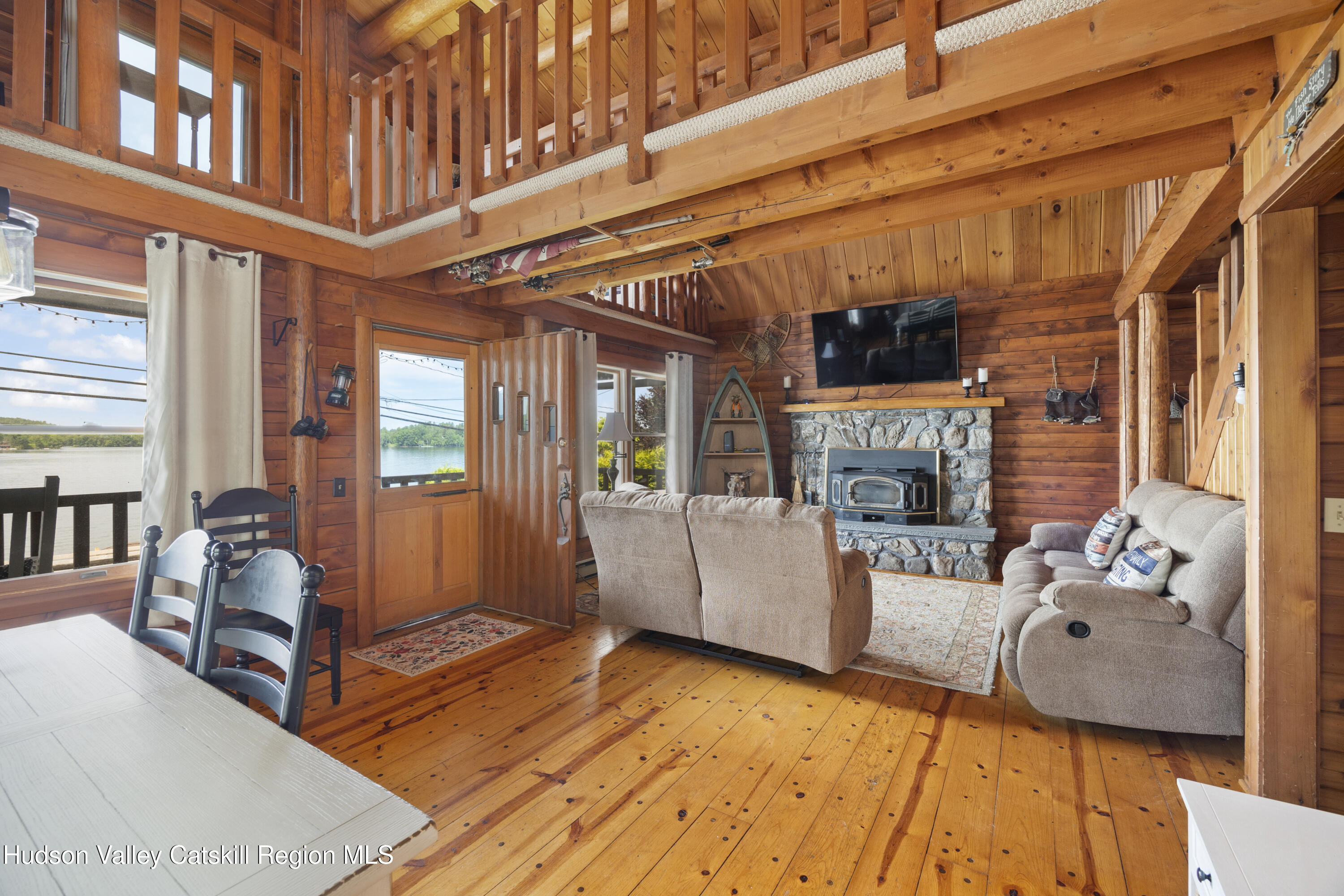407 Lakeview Road Craryville, NY 12521 - Photo 7 of 24 a living room with furniture and a fireplace