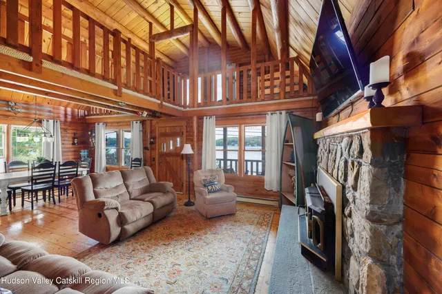 a living room with furniture or couch and a ceiling fan