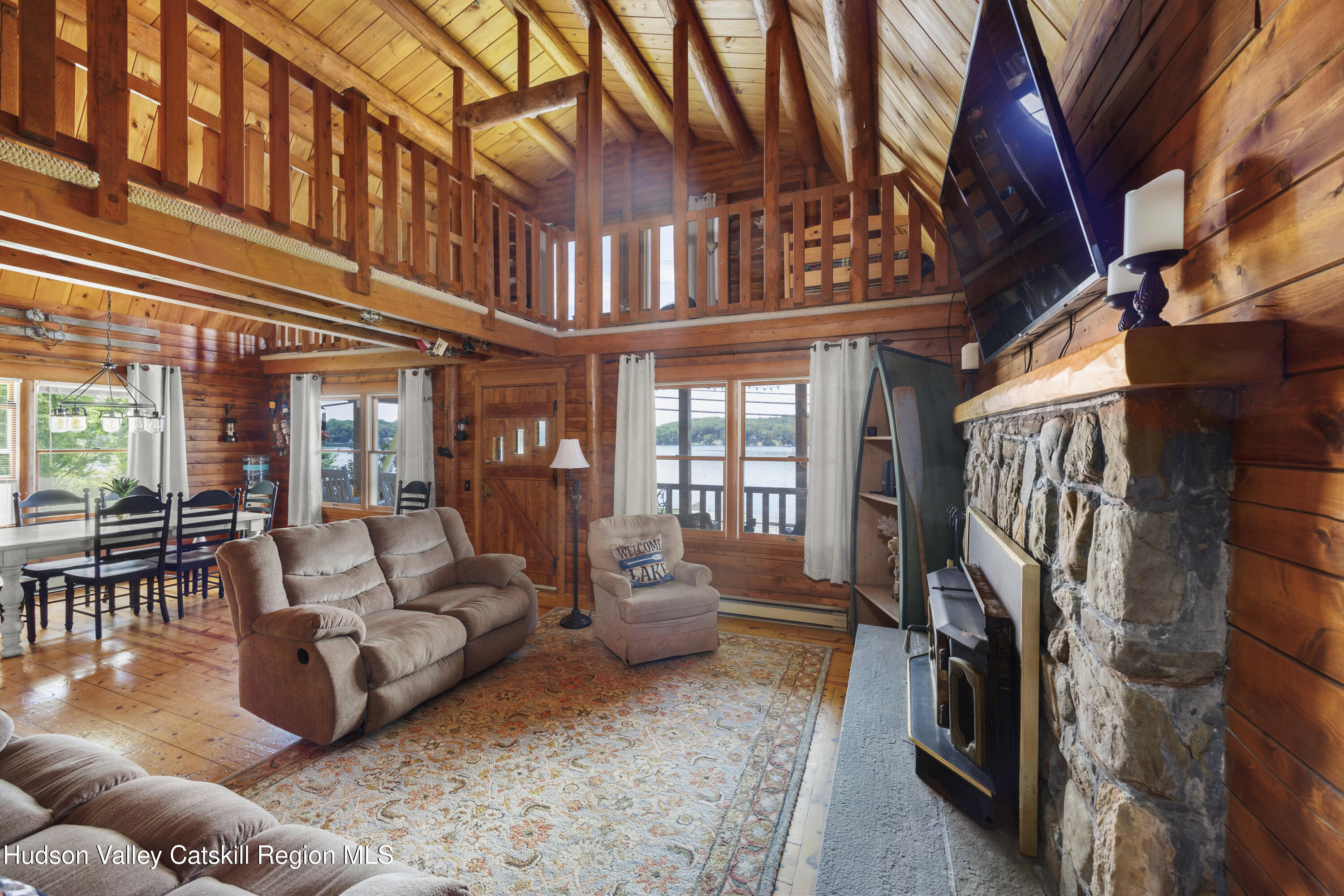 407 Lakeview Road Craryville, NY 12521 - Photo 8 of 24 a living room with furniture or couch and a ceiling fan