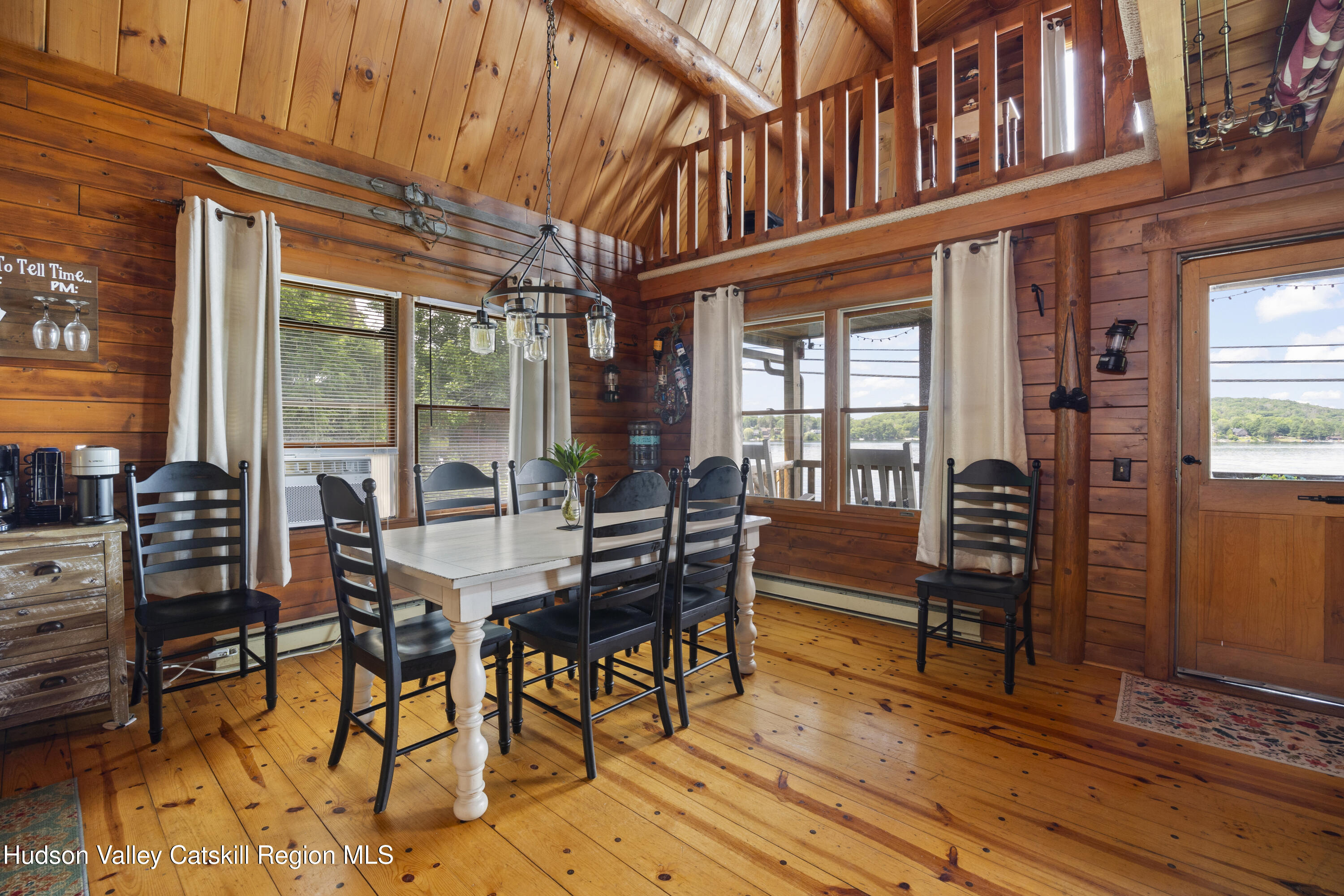 407 Lakeview Road Craryville, NY 12521 - Photo 10 of 24 a view of a patio with a table and chairs and wooden floor
