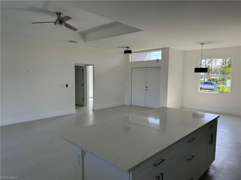 829 Albert Avenue Lehigh Acres, FL 33971 - Photo 11 of 27 wooden floor in a hall with an entryway