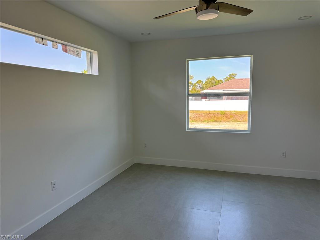 829 Albert Avenue Lehigh Acres, FL 33971 - Photo 12 of 27 an empty room with windows
