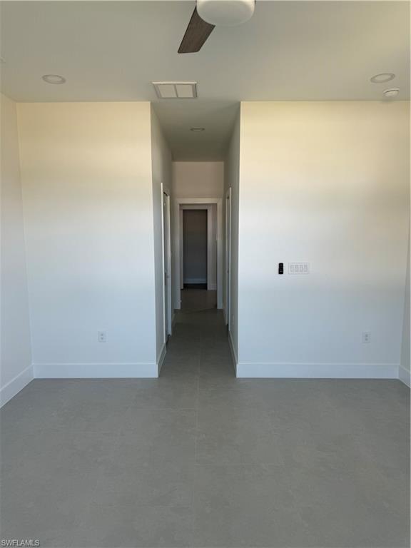 829 Albert Avenue Lehigh Acres, FL 33971 - Photo 14 of 27 an empty room with a natural light