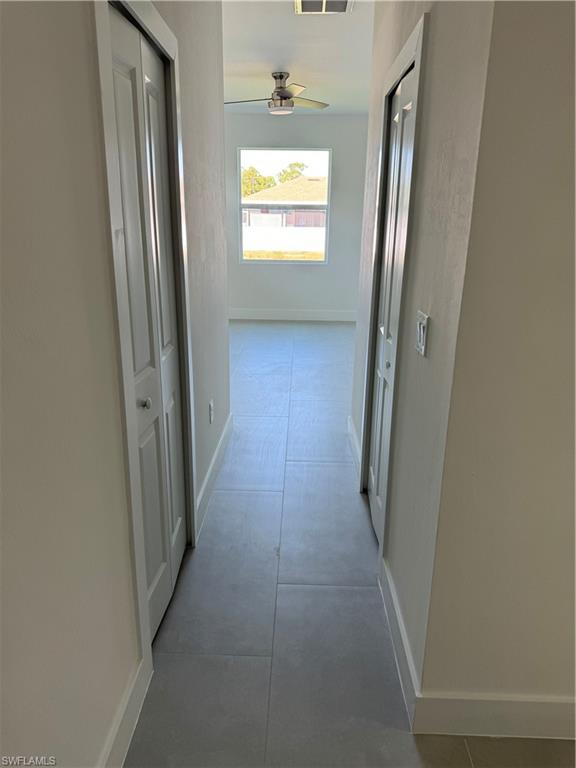 829 Albert Avenue Lehigh Acres, FL 33971 - Photo 15 of 27 a view of hallway with windows