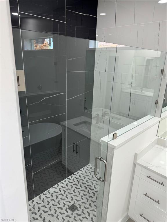 829 Albert Avenue Lehigh Acres, FL 33971 - Photo 19 of 27 a bathroom with a shower and a sink