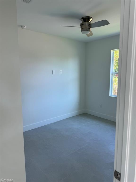 829 Albert Avenue Lehigh Acres, FL 33971 - Photo 24 of 27 an empty room with a window