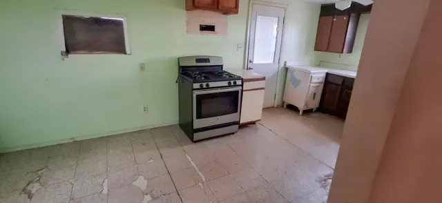 a kitchen with a stove and a microwave