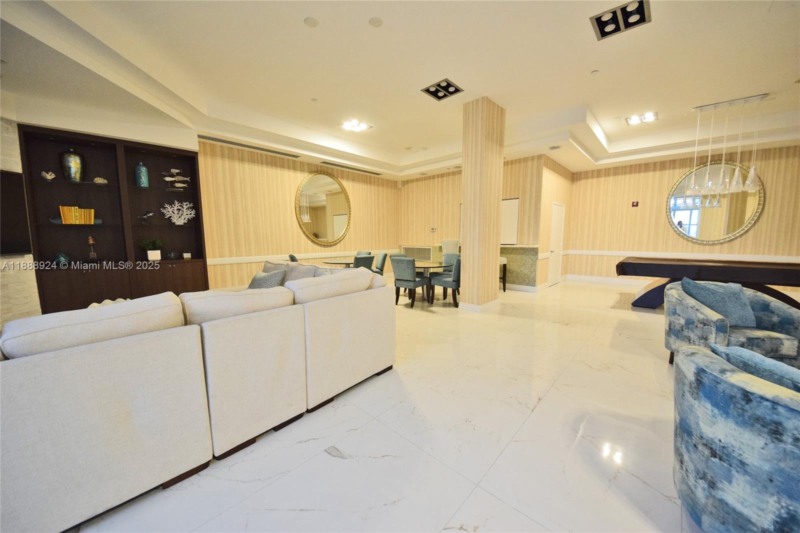 6917 Collins Avenue, Unit 1512 Miami Beach, FL 33141 - Photo 12 of 15 a living room with furniture and a large window