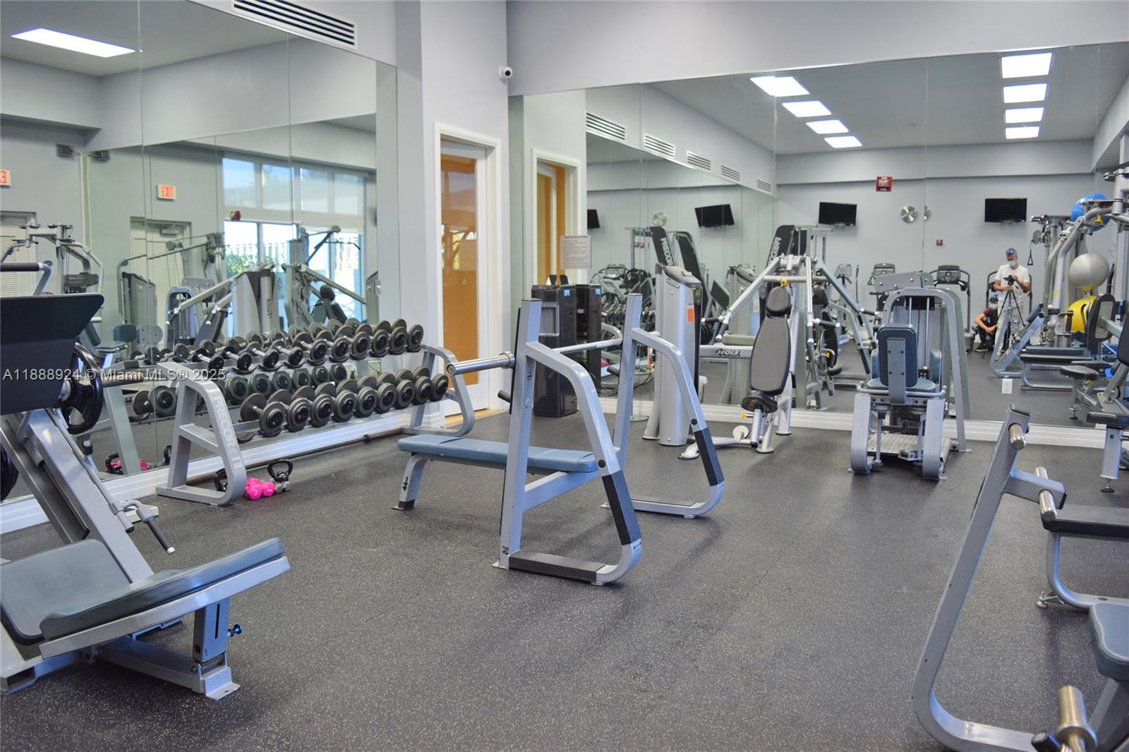 6917 Collins Avenue, Unit 1512 Miami Beach, FL 33141 - Photo 13 of 15 a view of a room with gym equipment