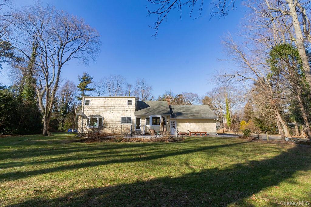 4 Conscience Bay Road Setauket, NY 11733 - Photo 23 of 26 a front view of a house with a big yard