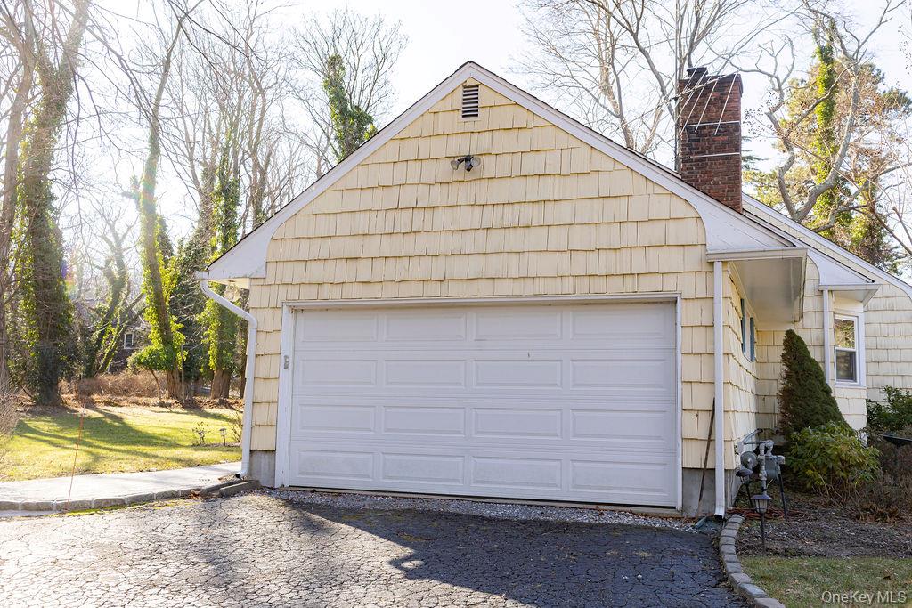 4 Conscience Bay Road Setauket, NY 11733 - Photo 24 of 26 a view of a house with a yard and large tree