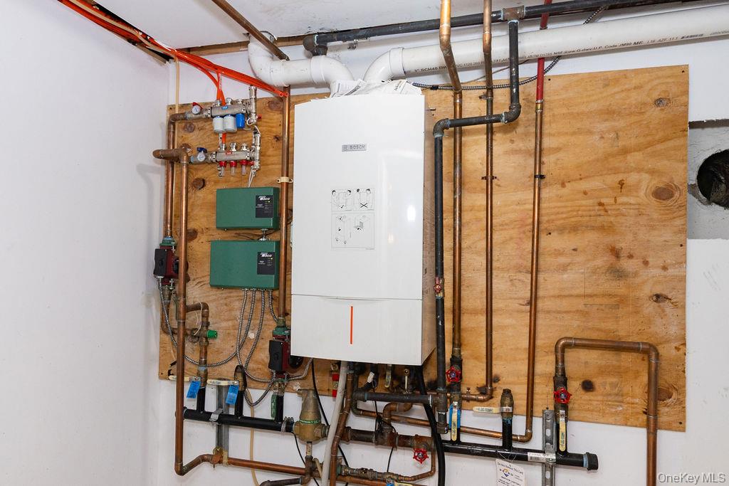 4 Conscience Bay Road Setauket, NY 11733 - Photo 25 of 26 a bathroom with a shower and a mirror