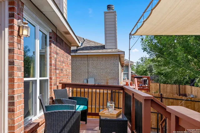 a view of balcony with furniture