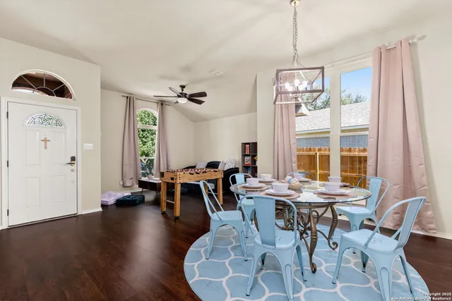 a view of a dining room with furniture window and outside view
