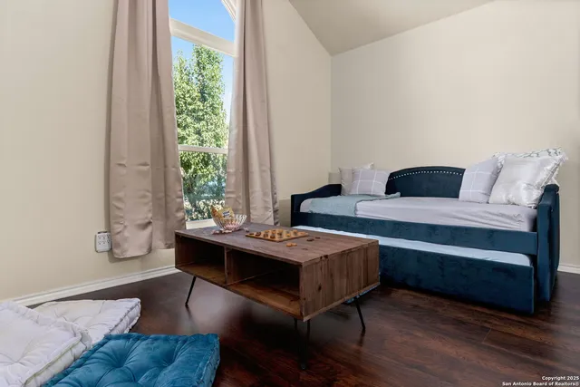 a view of a livingroom with furniture and window
