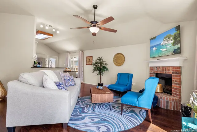 a living room with furniture and a fireplace