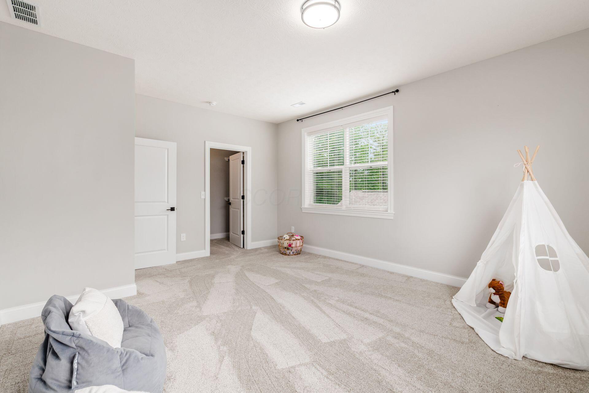 10341 Sawmill Road Powell, OH 43065 - Photo 34 of 51 upstairs large bedroom with 9' ceilings