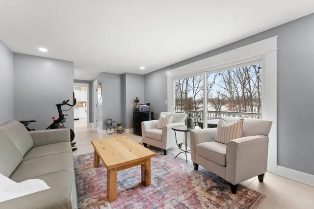 a bedroom with a bed and a ceiling fan