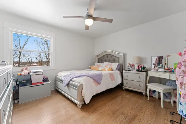 a view of a kitchen with a sink and a refrigerator