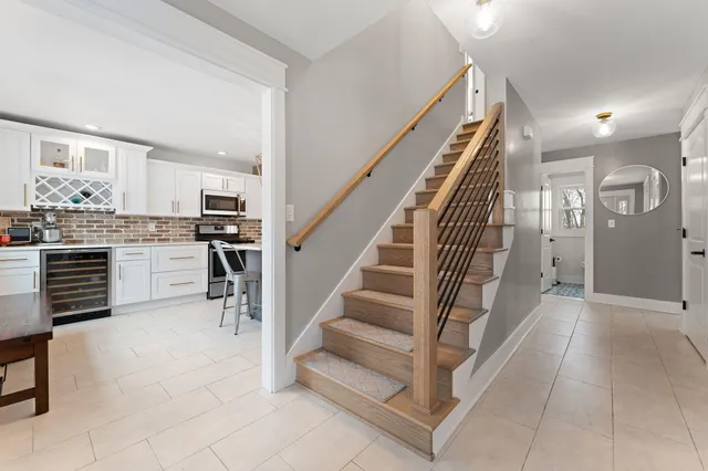 a kitchen with sink cabinets and stainless steel appliances