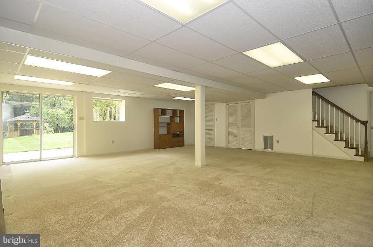 7483 Pindell School Road Fulton, MD 20759 - Photo 7 of 29 Level walk out exit to back yard & patio