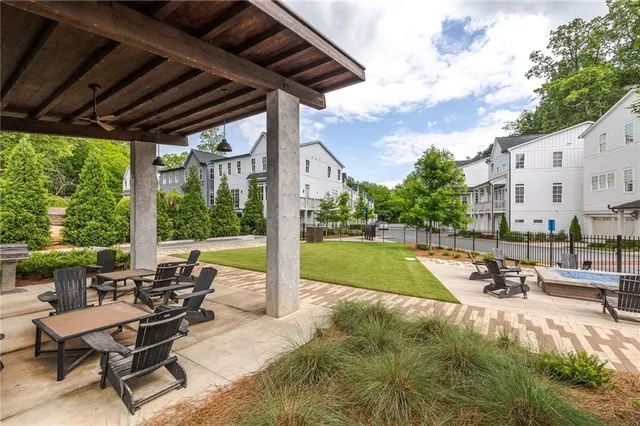 a view of swimming pool with outdoor seating and a patio