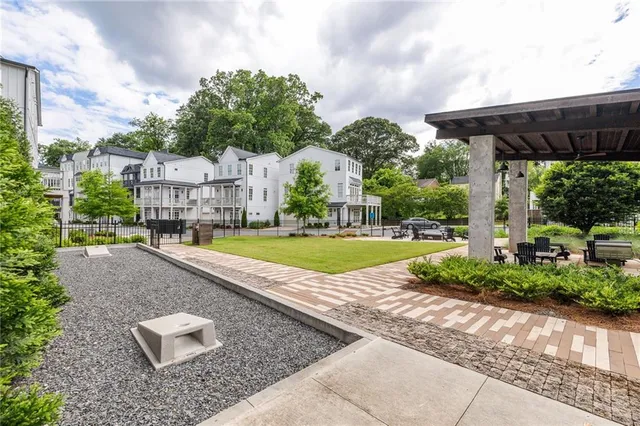 a view of yard with swimming pool and green space