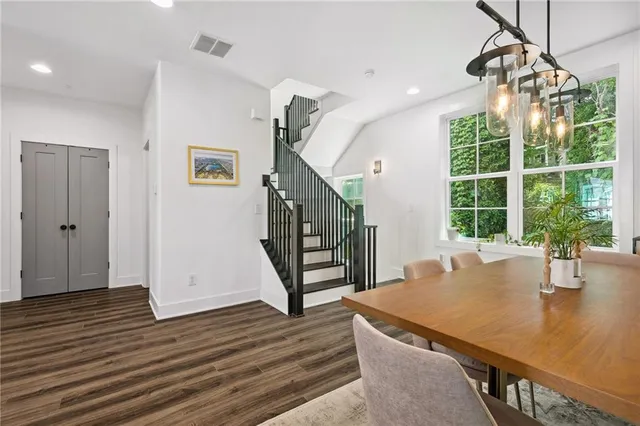 a view of a dining room with furniture window and wooden floor