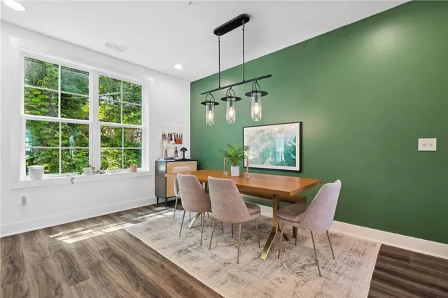 a view of a dining room with furniture window and outside view
