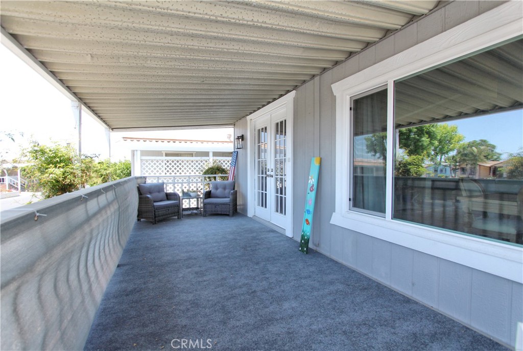 692 North Adele Street, Unit 101 Orange, CA 92867 - Photo 4 of 20 a view of a porch with furniture and floor to ceiling window